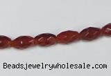 CAA124 15.5 inches 6*10mm faceted rice red agate gemstone beads