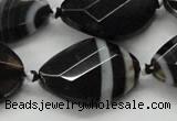 CAA286 22*30mm twisted & faceted oval black line agate beads