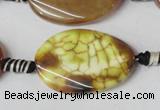 CAG1578 15.5 inches 20*30mm twisted oval fire crackle agate beads