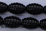 CAG1693 15.5 inches 15*20mm carved rice black agate beads