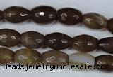 CAG3129 15.5 inches 10*14mm faceted rice brown line agate beads