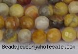 CAG9869 15.5 inches 6mm faceted round yellow crazy lace agate beads