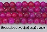 CAG9924 15.5 inches 4mm round fuchsia crazy lace agate beads