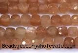 CCU885 15 inches 4mm faceted cube sunstone beads