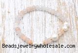 CFB711 faceted rondelle pink aventurine & potato white freshwater pearl stretchy bracelet