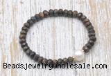 CFB754 faceted rondelle bronzite & potato white freshwater pearl stretchy bracelet