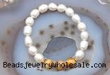 CFB914 9mm - 10mm rice white freshwater pearl & golden tiger eye stretchy bracelet