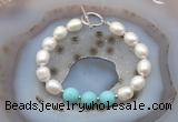 CFB943 Hand-knotted 9mm - 10mm rice white freshwater pearl & blue howlite bracelet