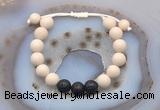 CGB6670 10mm round white fossil jasper & black lava adjustable bracelets