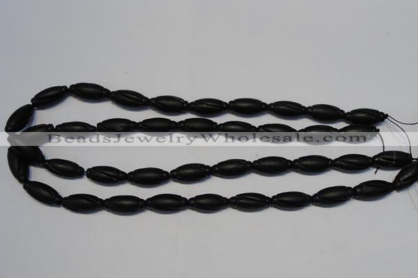 CNE15 15.5 inches 9*20mm carved rice black stone needle beads wholesale