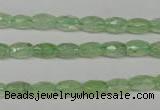 CRU165 15.5 inches 5*8mm faceted rice green rutilated quartz beads