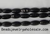 CTO116 15.5 inches 5*10mm faceted rice black tourmaline beads